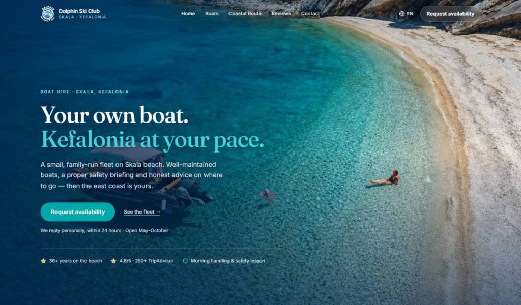 Dolphin Ski Club website desktop homepage with a Kefalonia coastline and boat